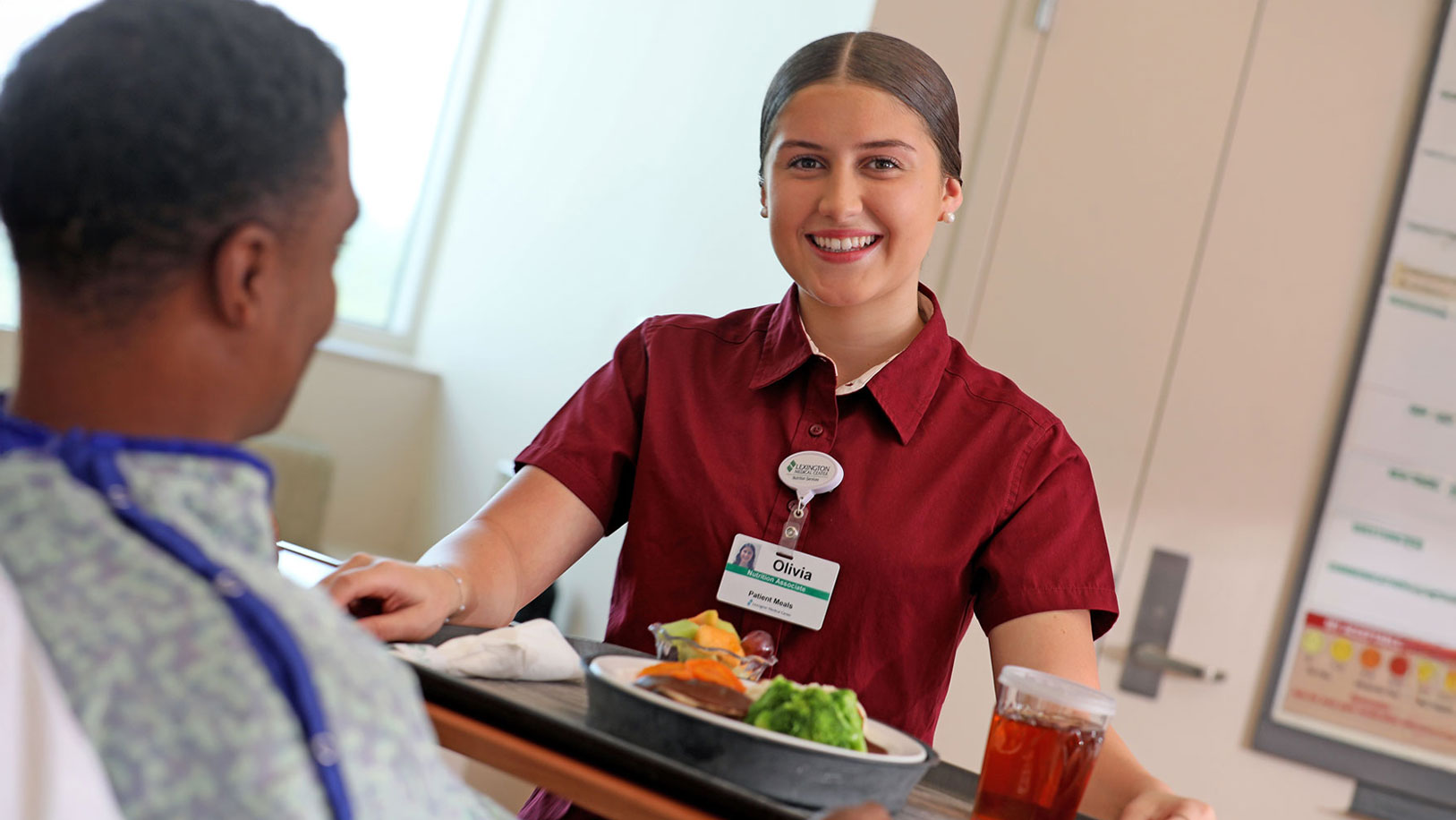 Woman carrying food tray